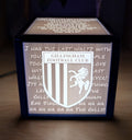 Light-up box with Gillingham Football Club logo and text on a wooden surface